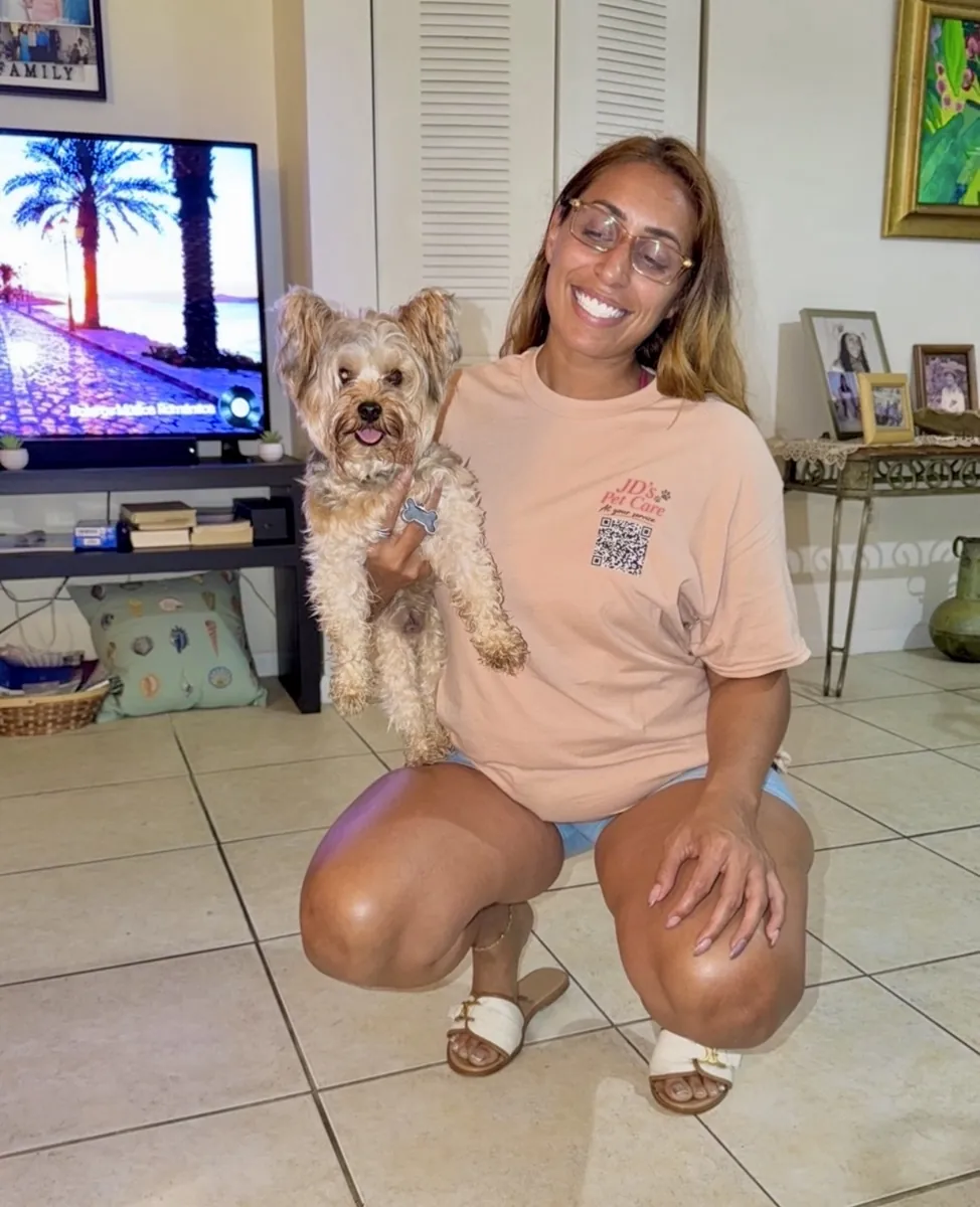Joselyn of JD's Pet Care with a Yorkie